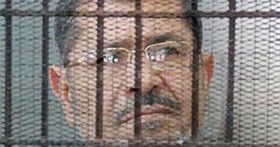 فریاد حمایت مرسی از غزه در قفس اتهام